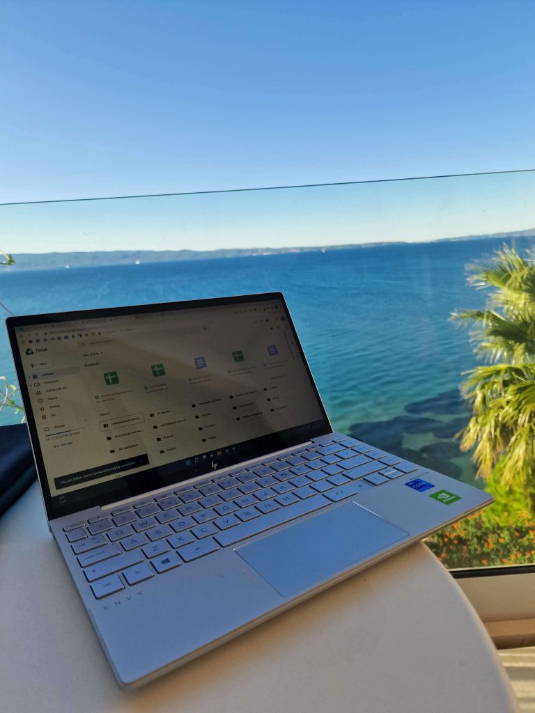 laptop in front of a blue sea in croatia